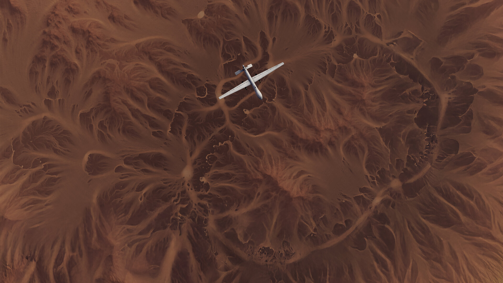 plane over a desert with topography