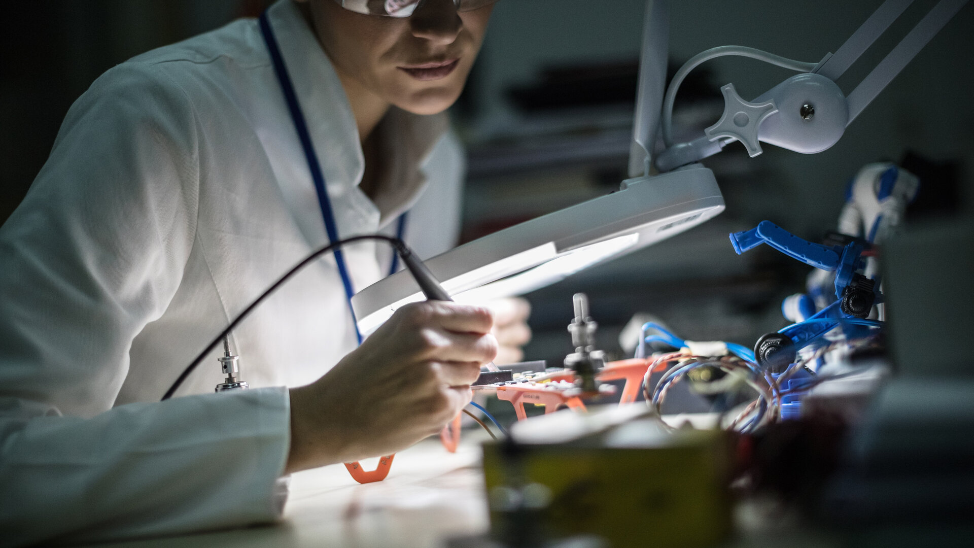 female inspecting a drone