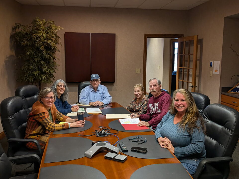 team sitting at a conference table